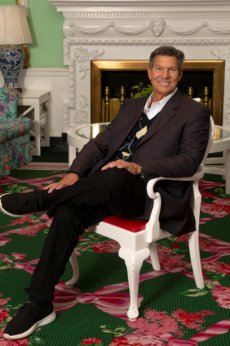 Brett Machtig is older sitting in a colorful room